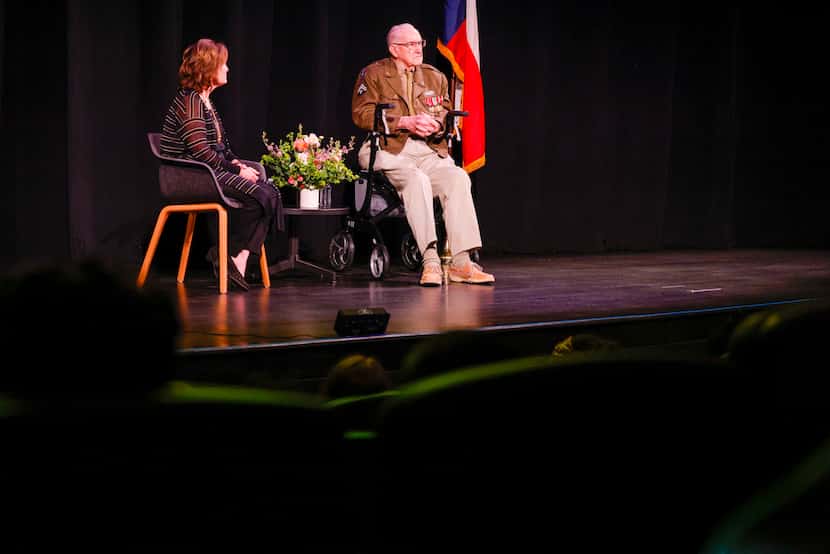WIlliam "Bill" Kongable speaks during a presentation to students alongside moderator Fran...