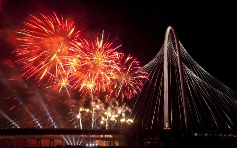 Fireworks exploded over the Margaret Hunt Hill Bridge following opening-night festivities in...
