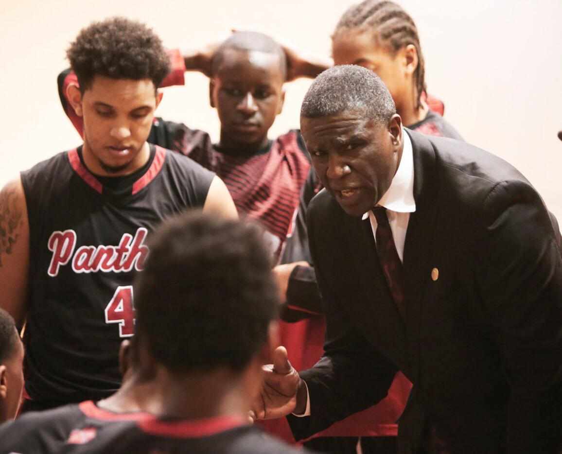 Von Harris coaches the Hillcrest High boys basketball team during a playoff game with...