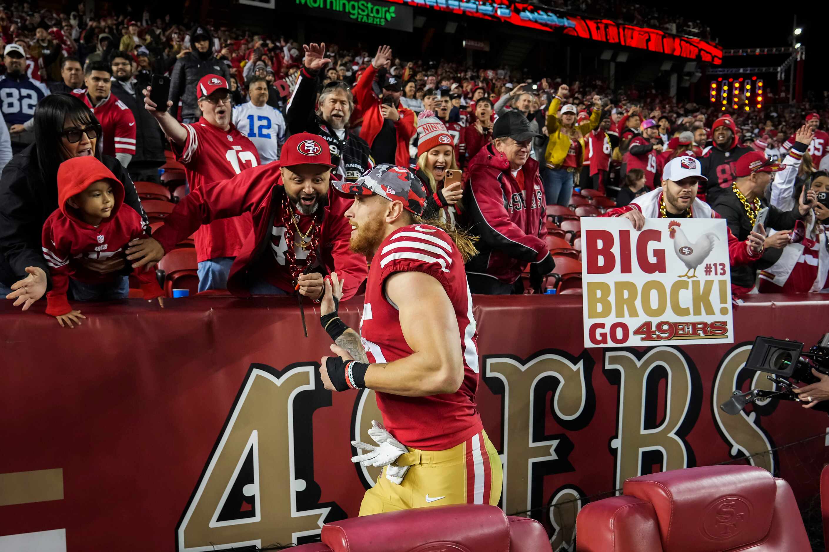 San Francisco 49ers tight end George Kittle (85) celebrates with fans after a victory over...