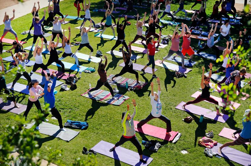 Indigo Yoga hosts a free yoga class on the lawn outside Press Cafe at The Trailhead at...