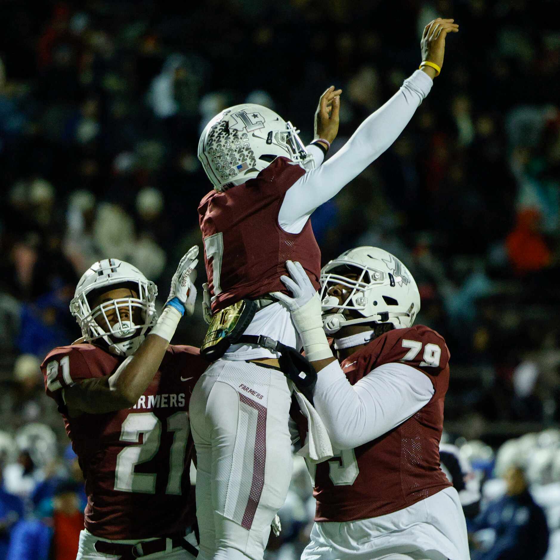 Lewisville quarterback Ethan Terrell (7) celebrates his touchdown with running back Viron...