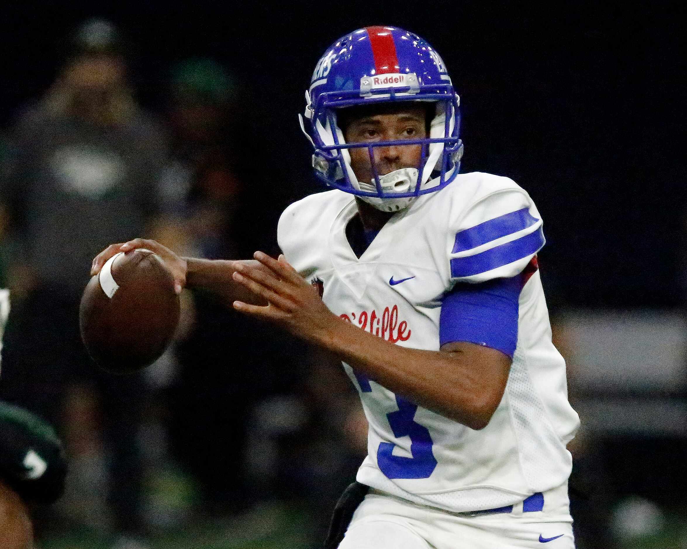 Duncanville High School quarterback Solomon James (3) throws a pass during the first half as...