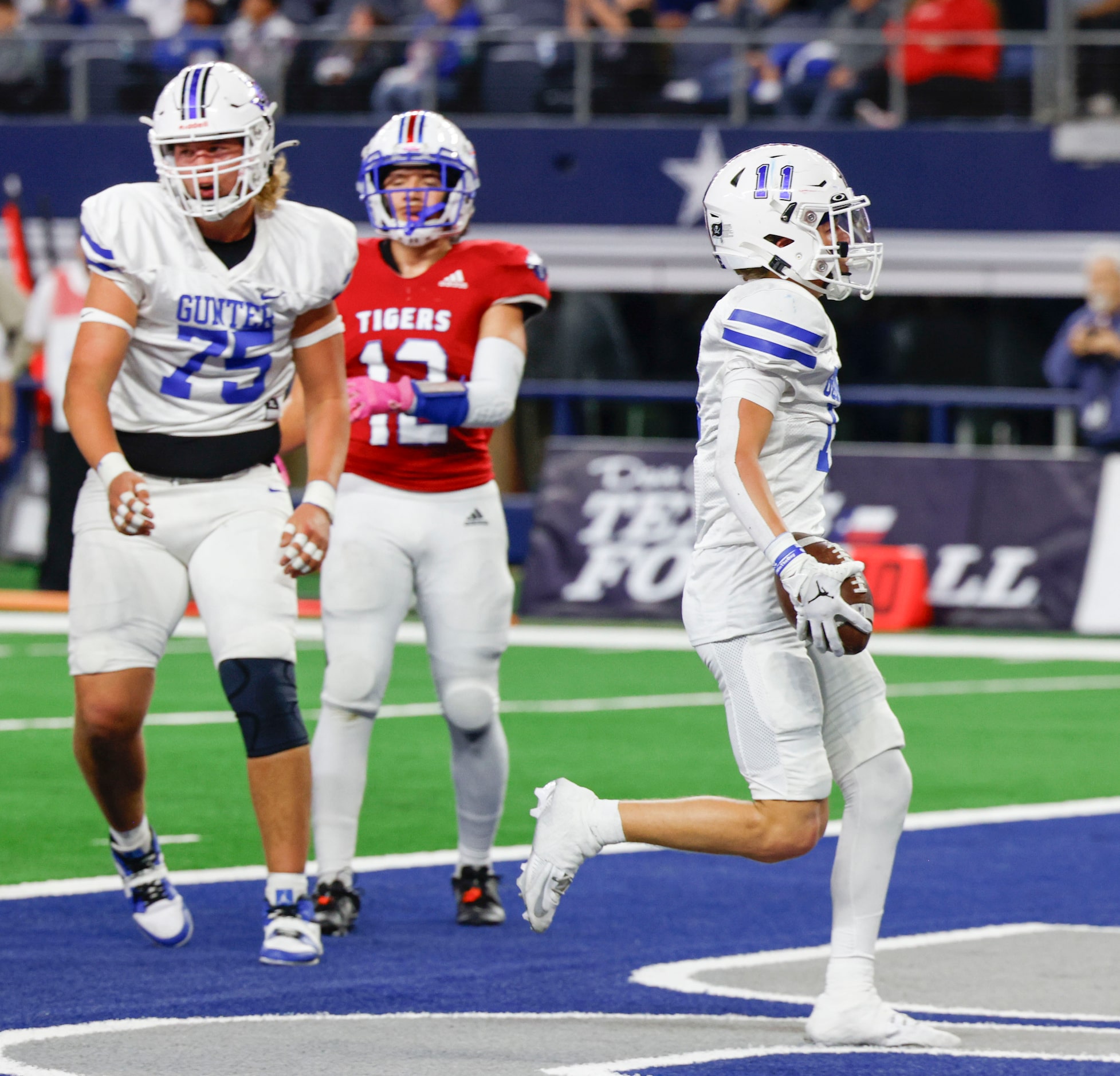 Gunter High’s Brock Boddle (11) scores a touchdown against El Maton Tidehaven during the...