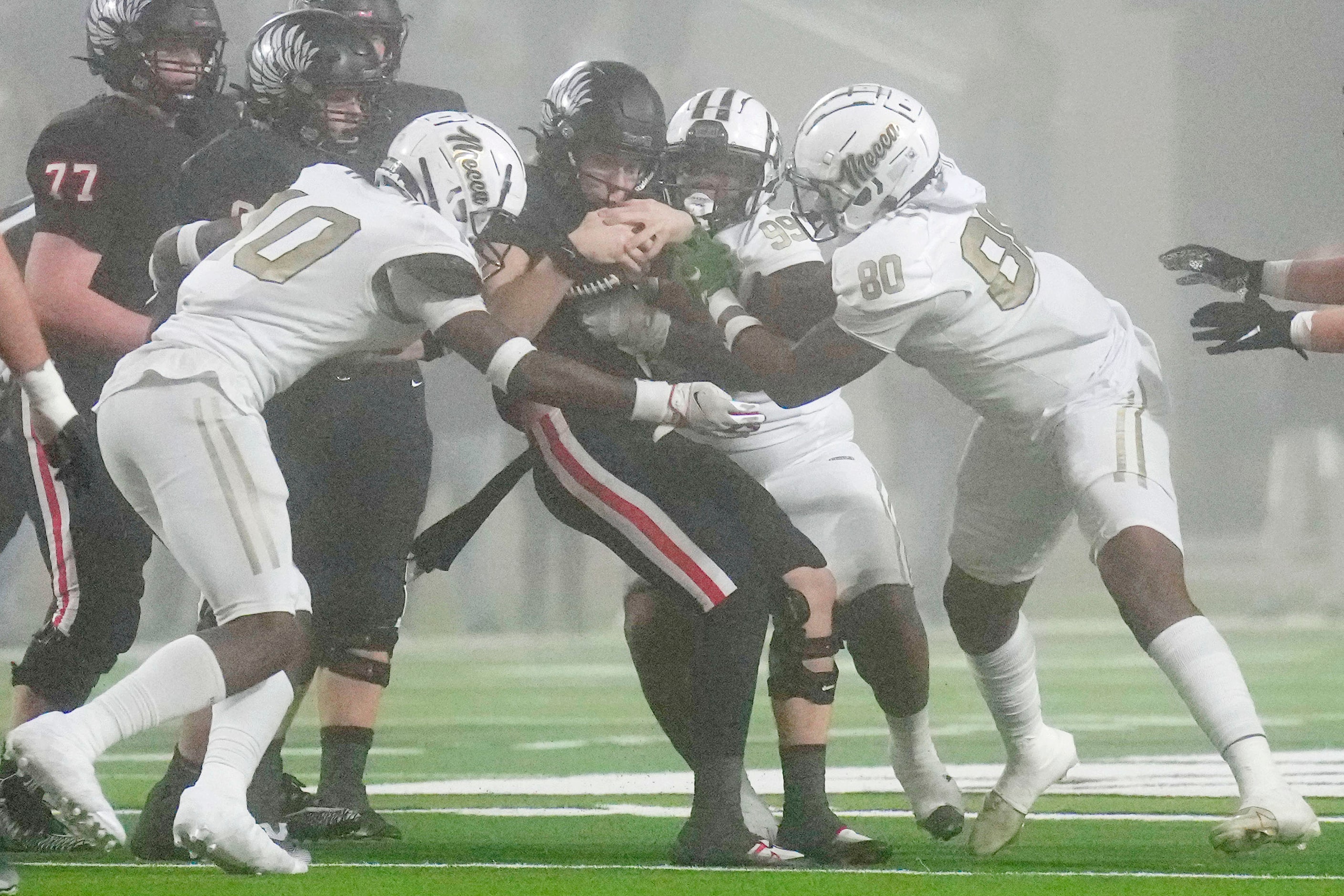 Argyle quarterback John Gailey (12) is sacked by South Oak Cliff’s Billy Walton (10),...