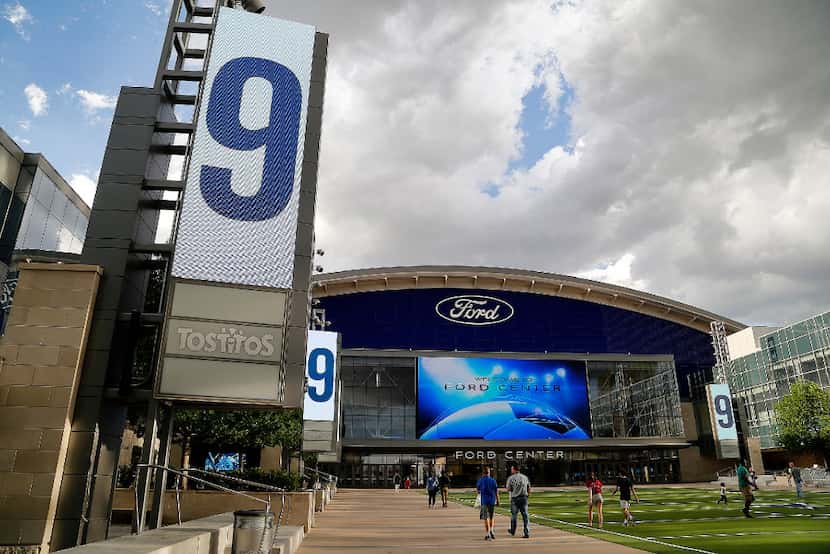 Tony Romo's number was put on the screens at Tostitos Plaza in front of the Ford Center at...