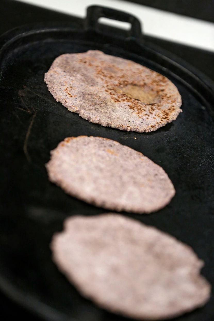 Dotty Griffith cooks Blue Corn Tortillas. 