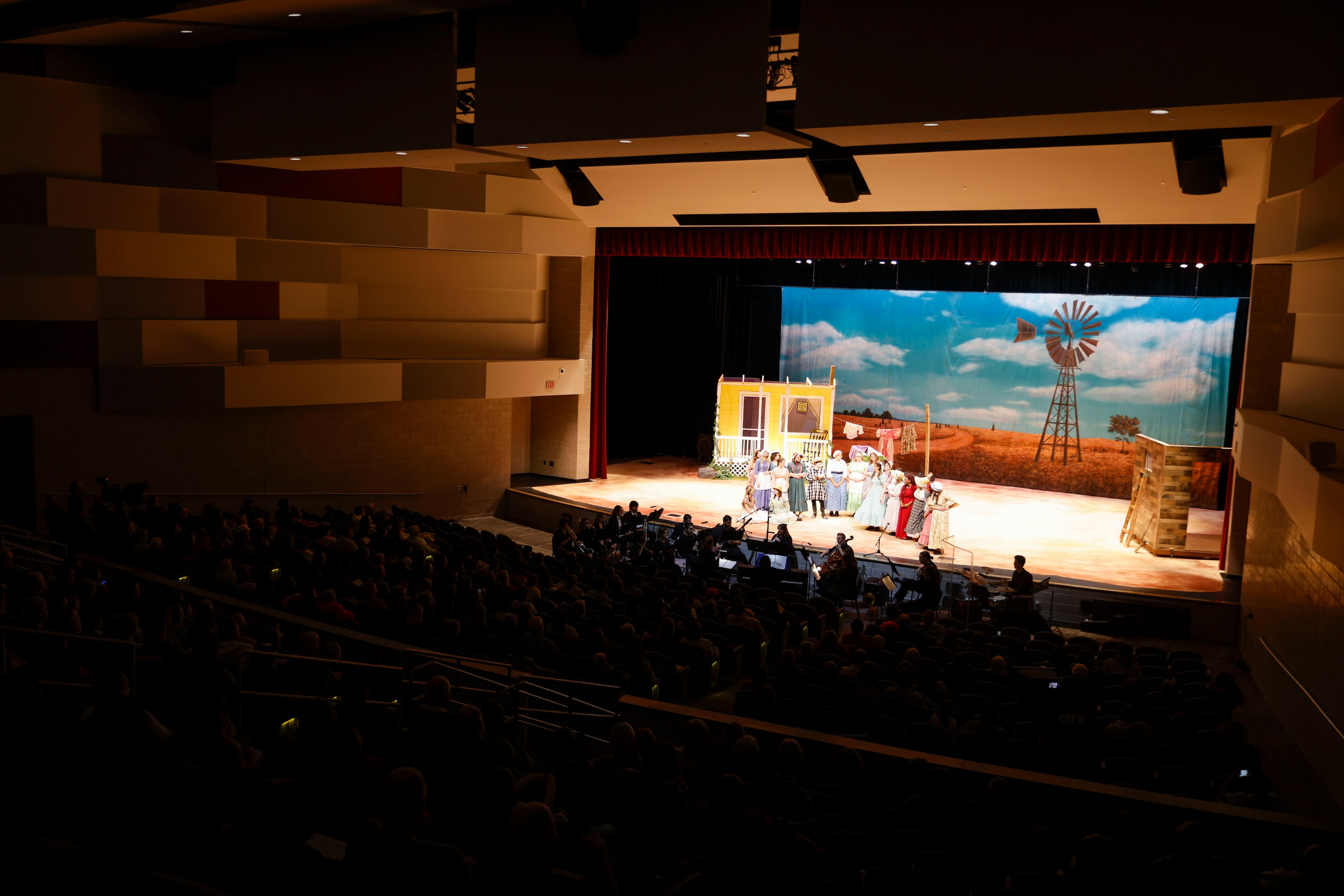 Caste members perform during the opening night of the Sherman High School production of...