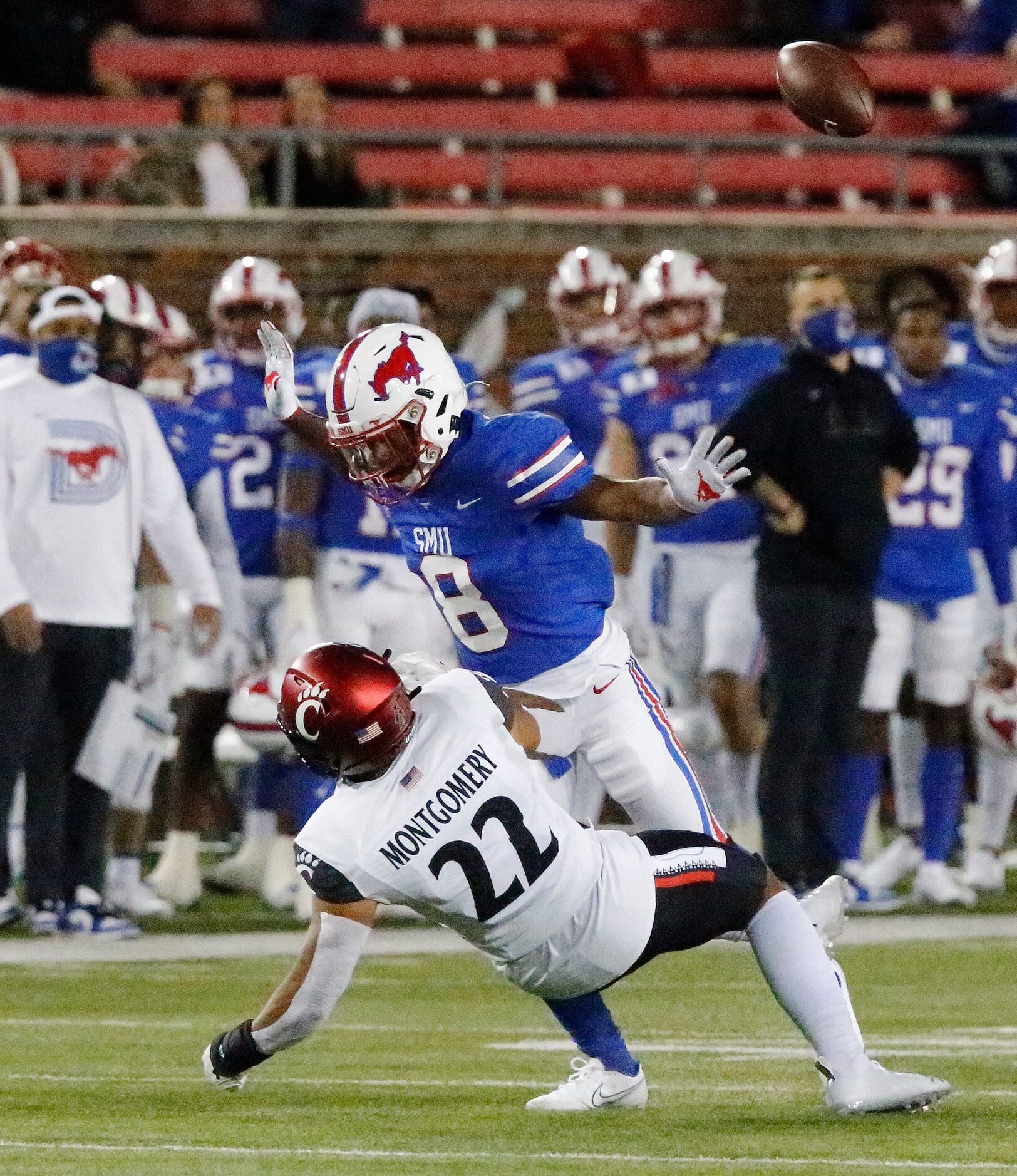 Southern Methodist Mustangs cornerback Bryan Massey (8) runs into Cincinnati Bearcats punt...