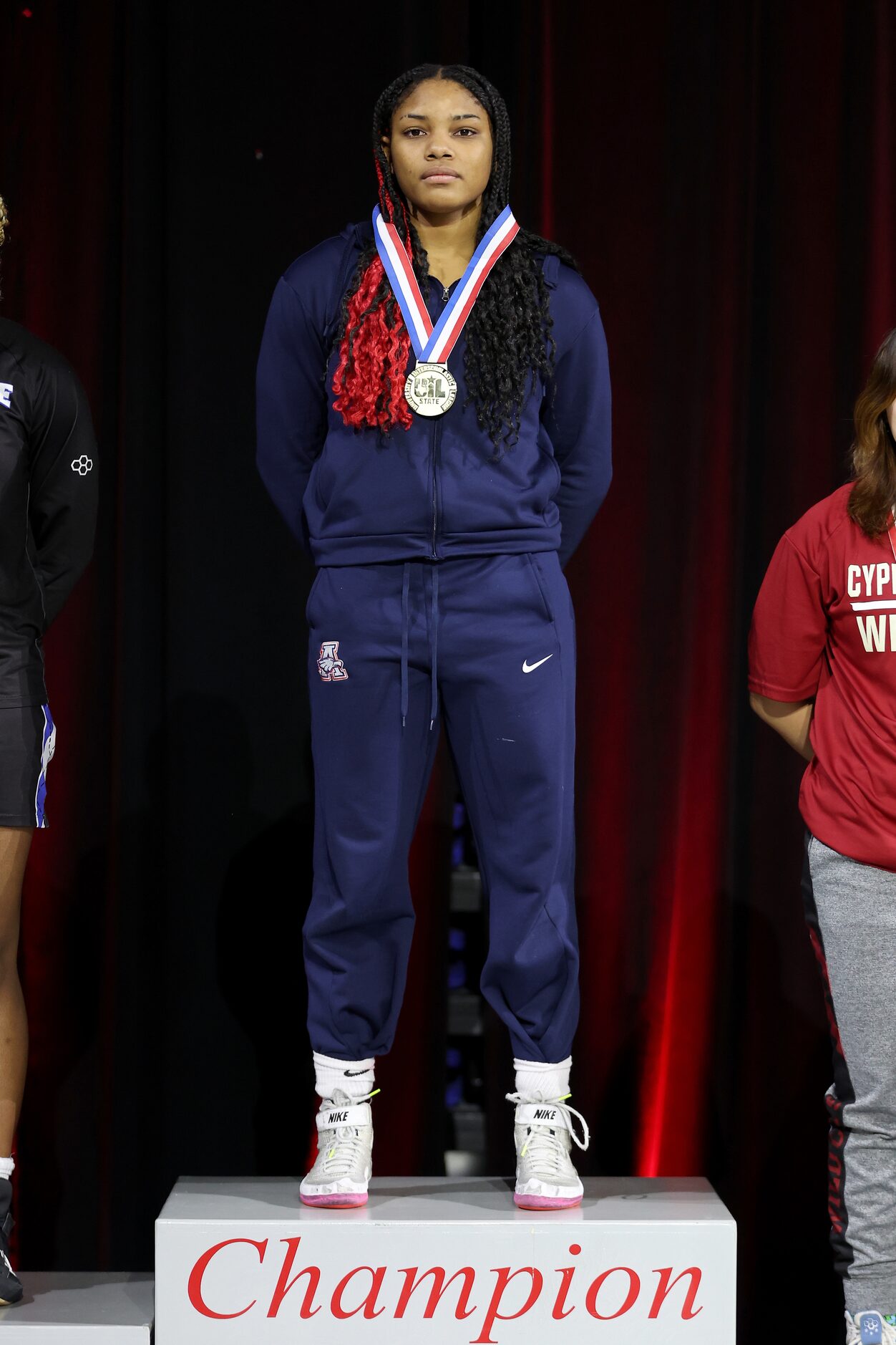 Jasmine Robinson of Allen is awarded the championship medal after winning the Girls 6A...