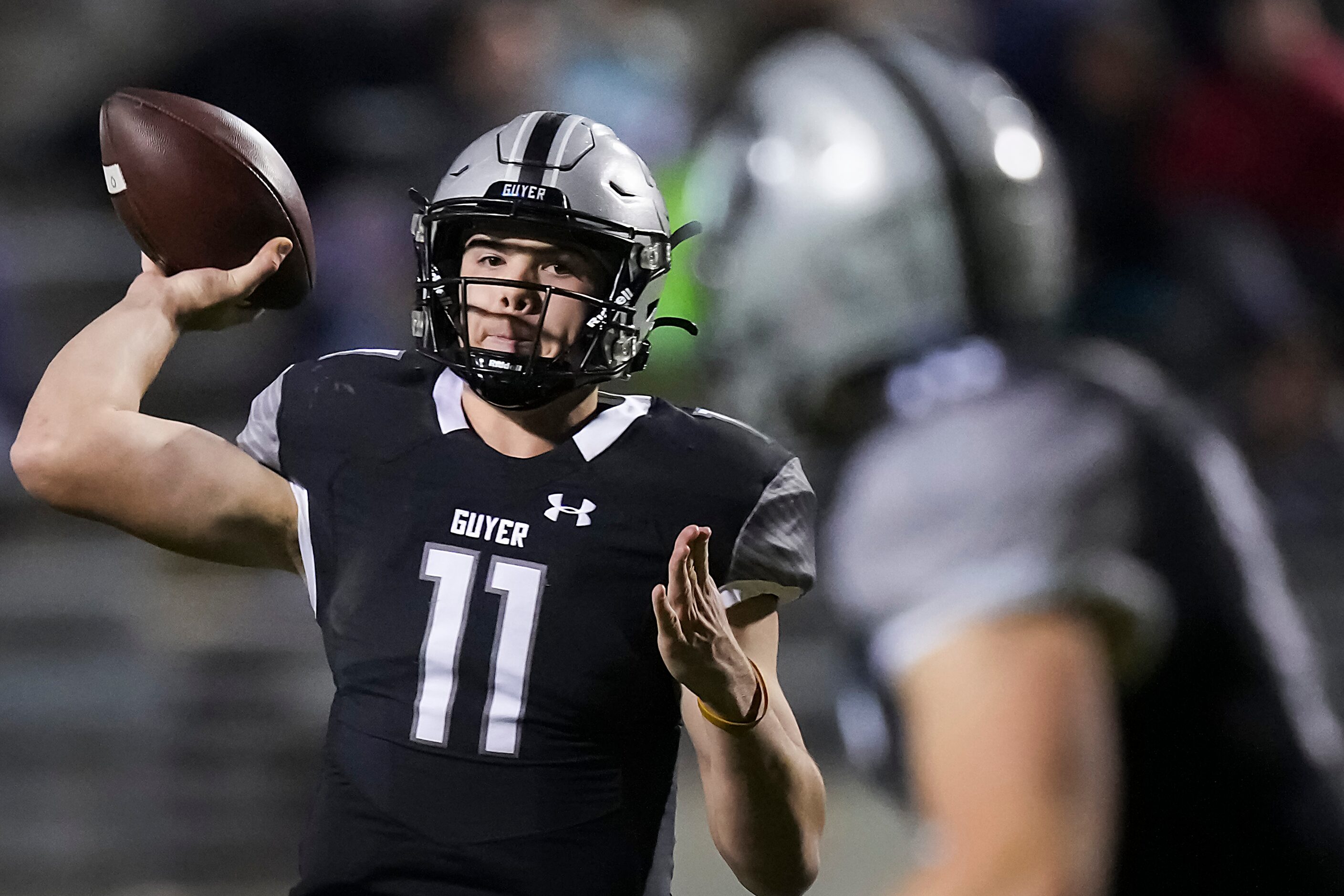 Denton Guyer quarterback Jackson Arnold (11) throws a pass to running back Jackson Foster...