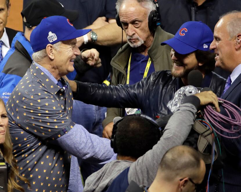 Bill Murray and Eddie Vetter celebrate after Game 7 of the Major League Baseball World...