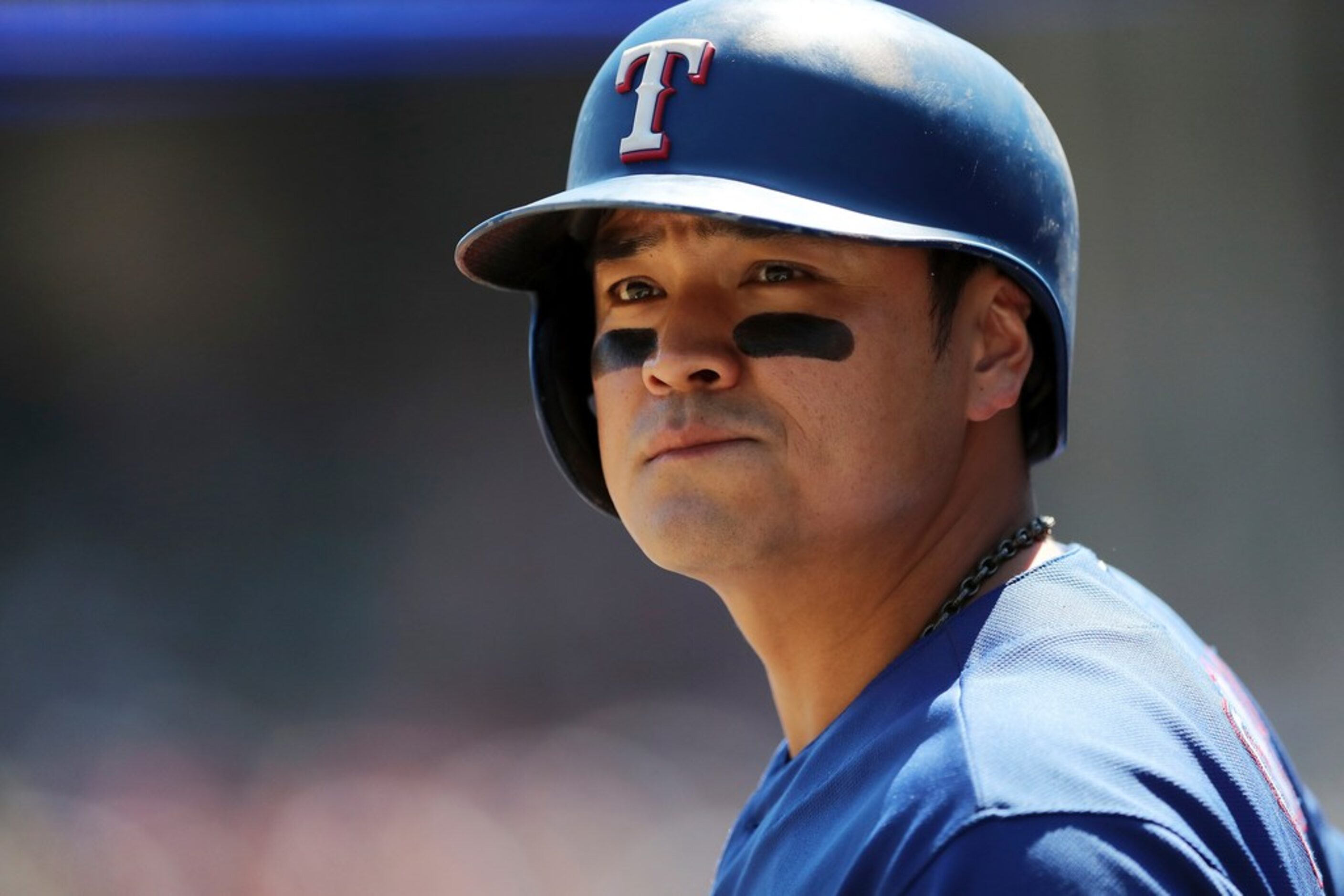 Texas Rangers' Shin-Soo Choo is seen in the dugout during the seventh inning of a baseball...