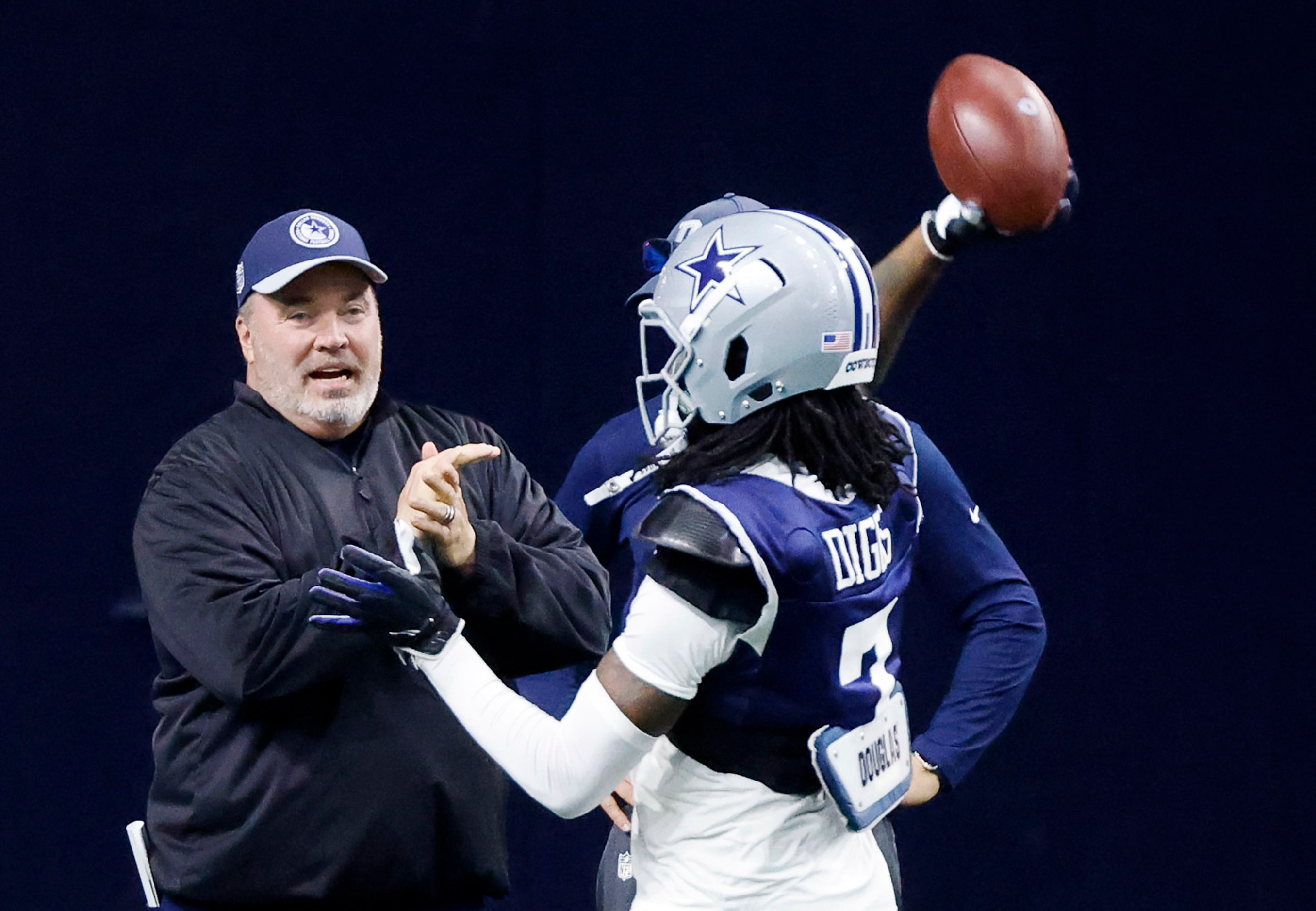 Dallas Cowboys cornerback Trevon Diggs (7) tries his arm at quarterback as head coach Mike...