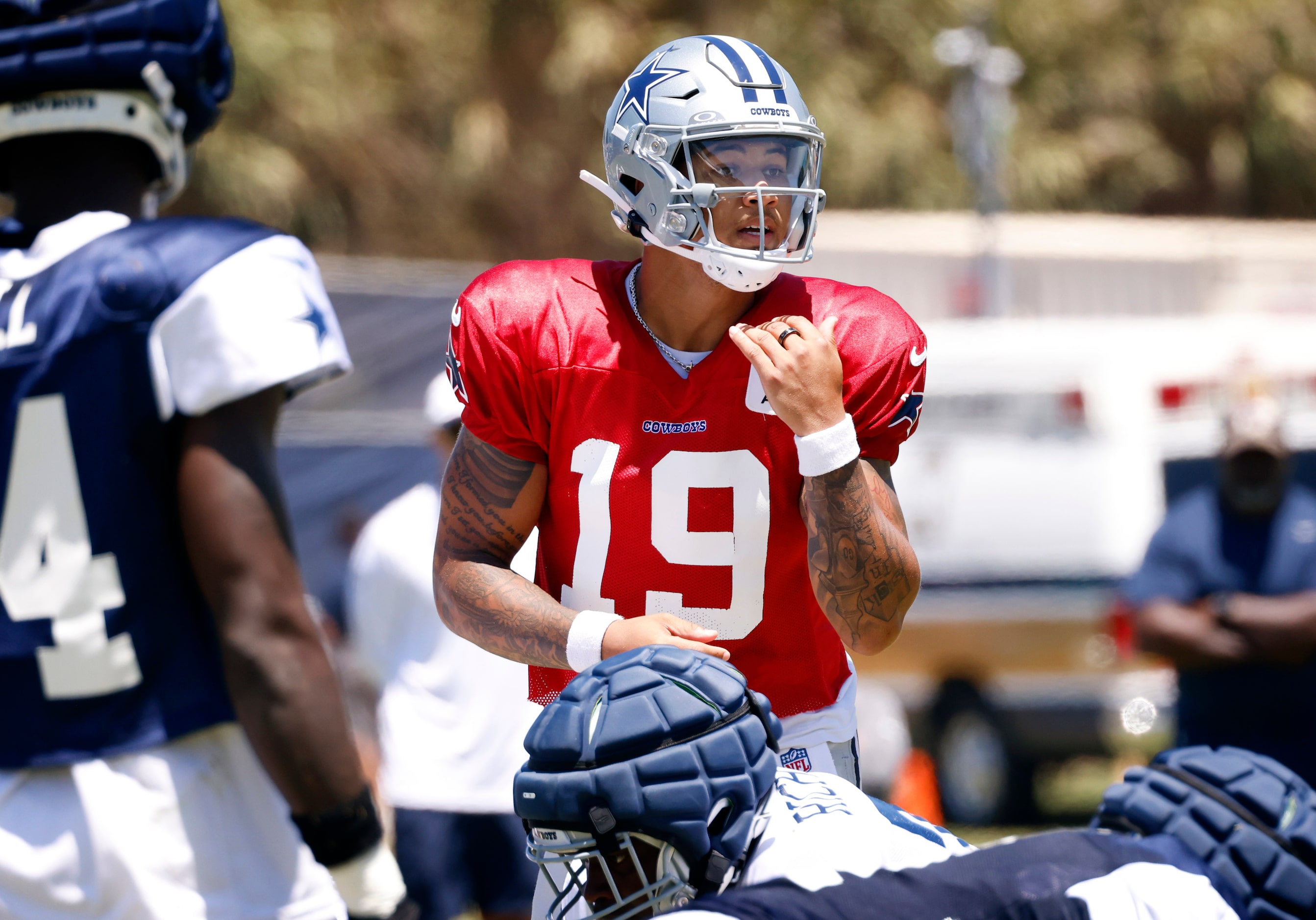 Dallas Cowboys quarterback Trey Lance (19) kills a play at the line of scrimmage during...