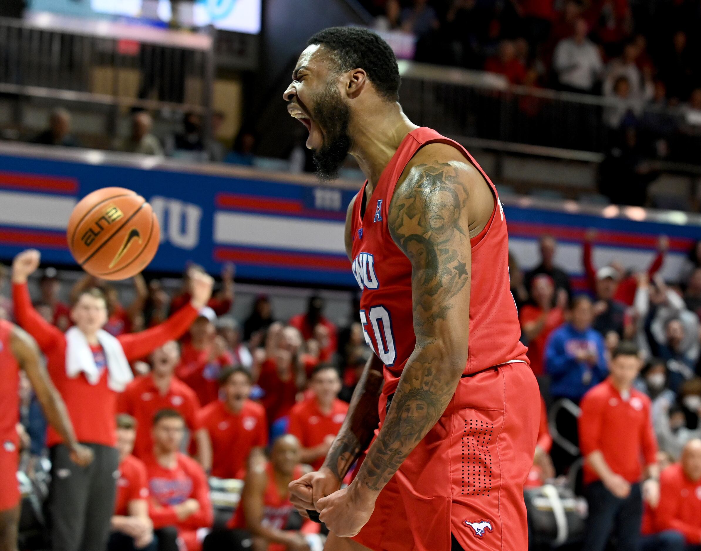 SMU forward Marcus Weathers (50) celebrate after a dunk in the second half during a men’s...