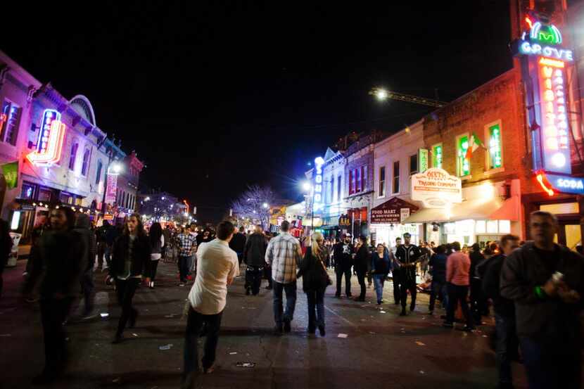 The crowd walk along the closed 6th Street in Austin, TX for SXSW on March 13, 2014.  Thao...