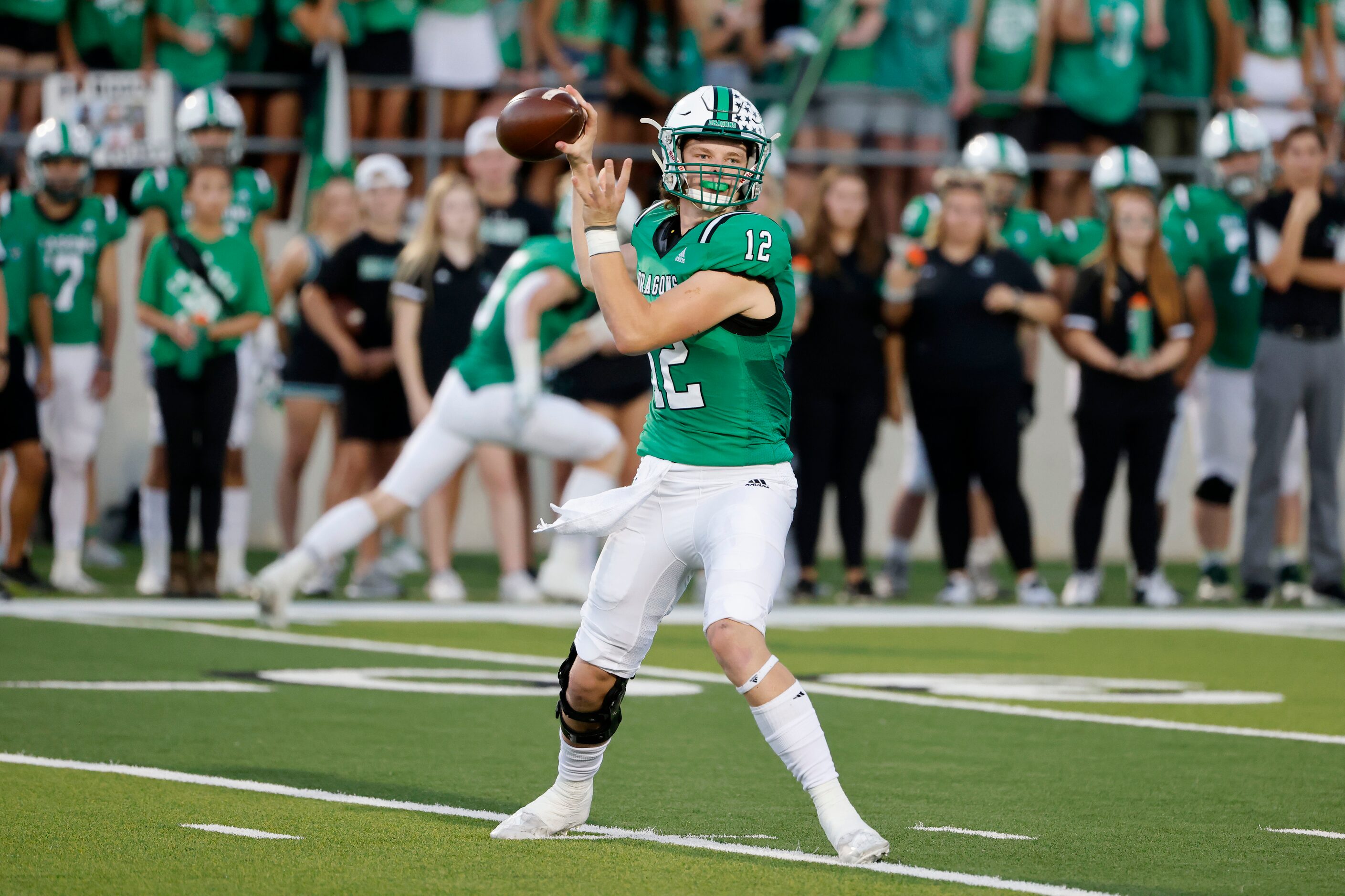 Southlake Carroll quarterback Kaden Anderson (12) throw against Arlington Martin during a...