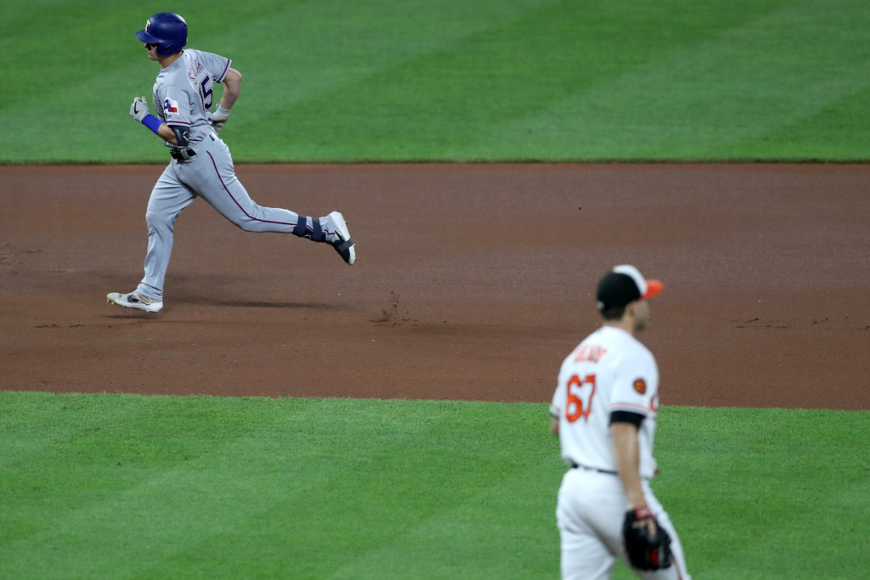 BALTIMORE, MARYLAND - SEPTEMBER 05: Nick Solak #15 of the Texas Rangers rounds the bases...