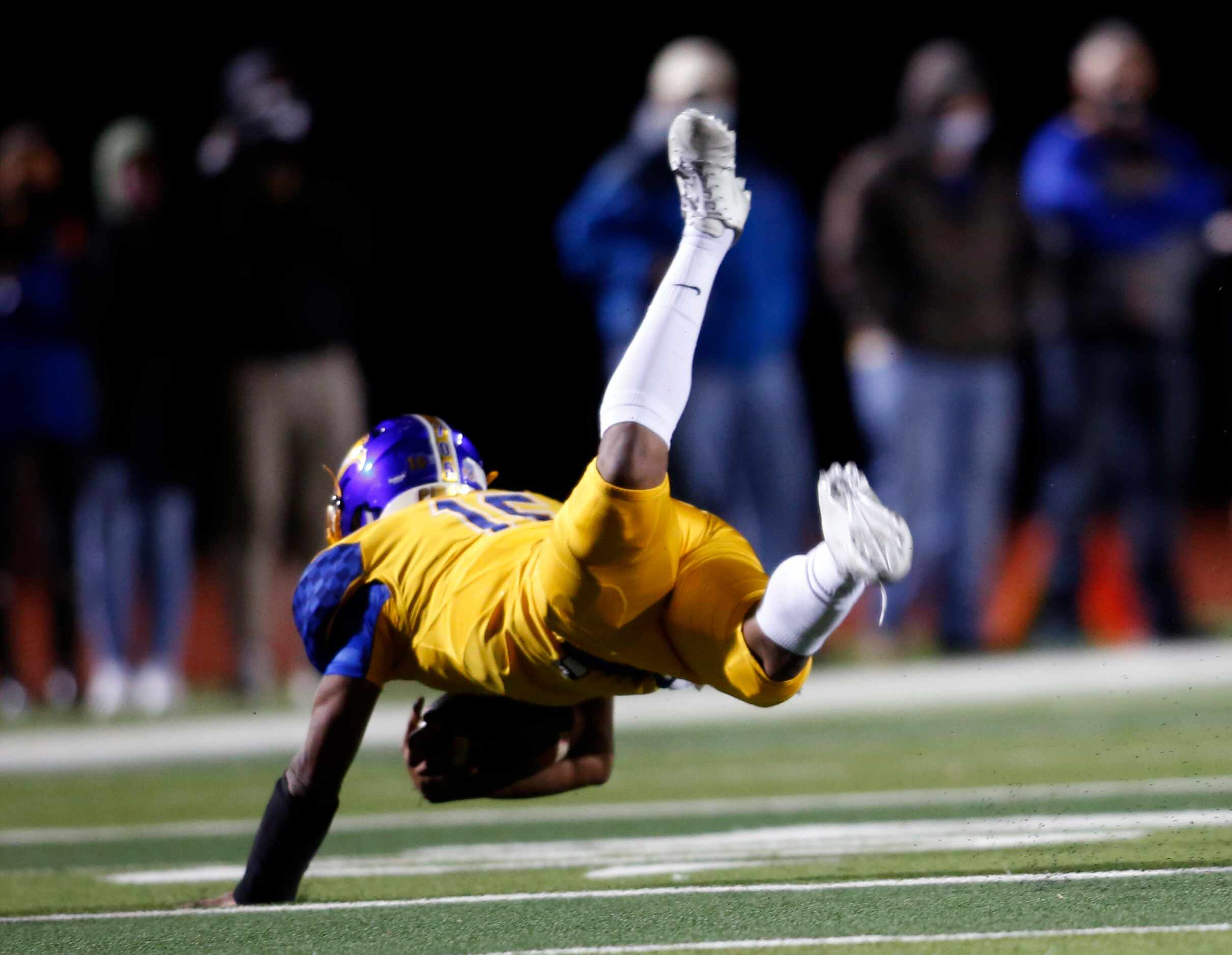 Waco LaVega quarterback Ara Rauls lll (16) looses his footing as he rolls out of the...