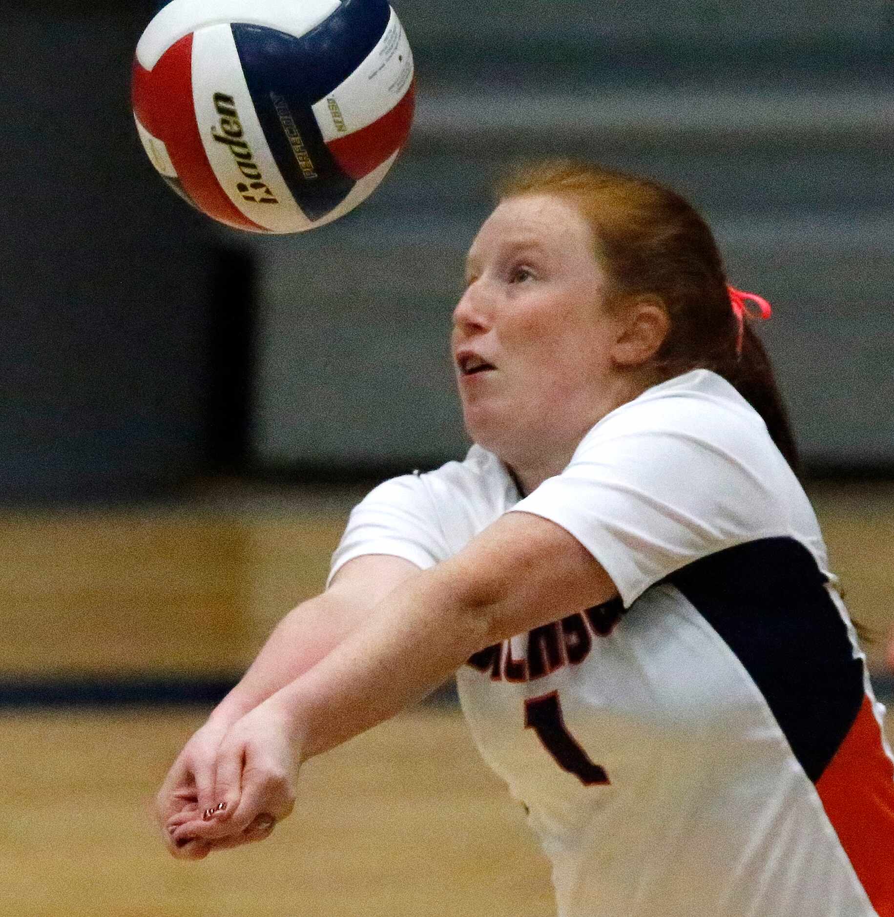 Sachse High School defensive specialist Karissa Korinek (1) passes the volleyball during...