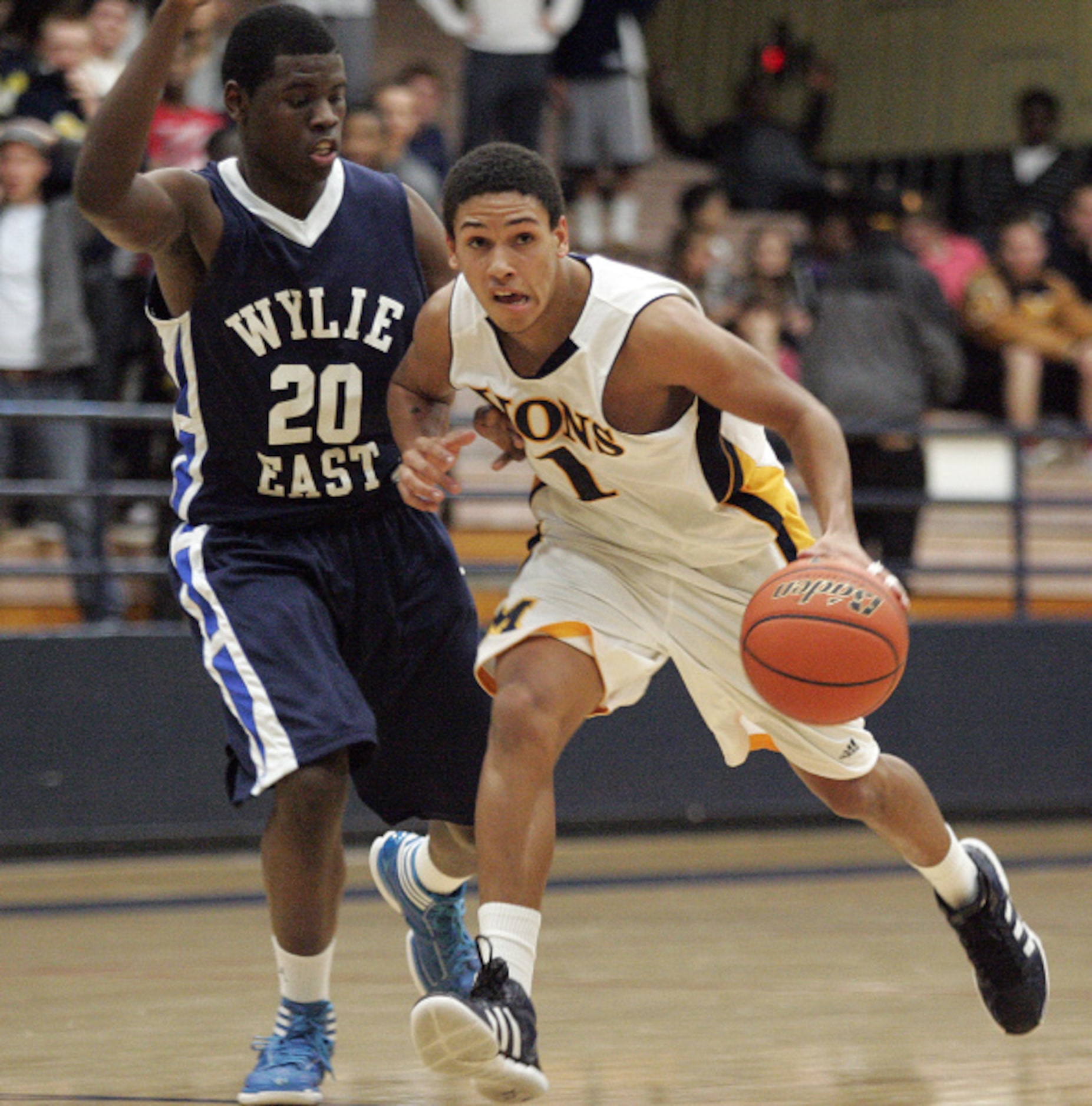 McKinney High School's Conner Fuentes (1) dribbles the basketball down court against Wylie...