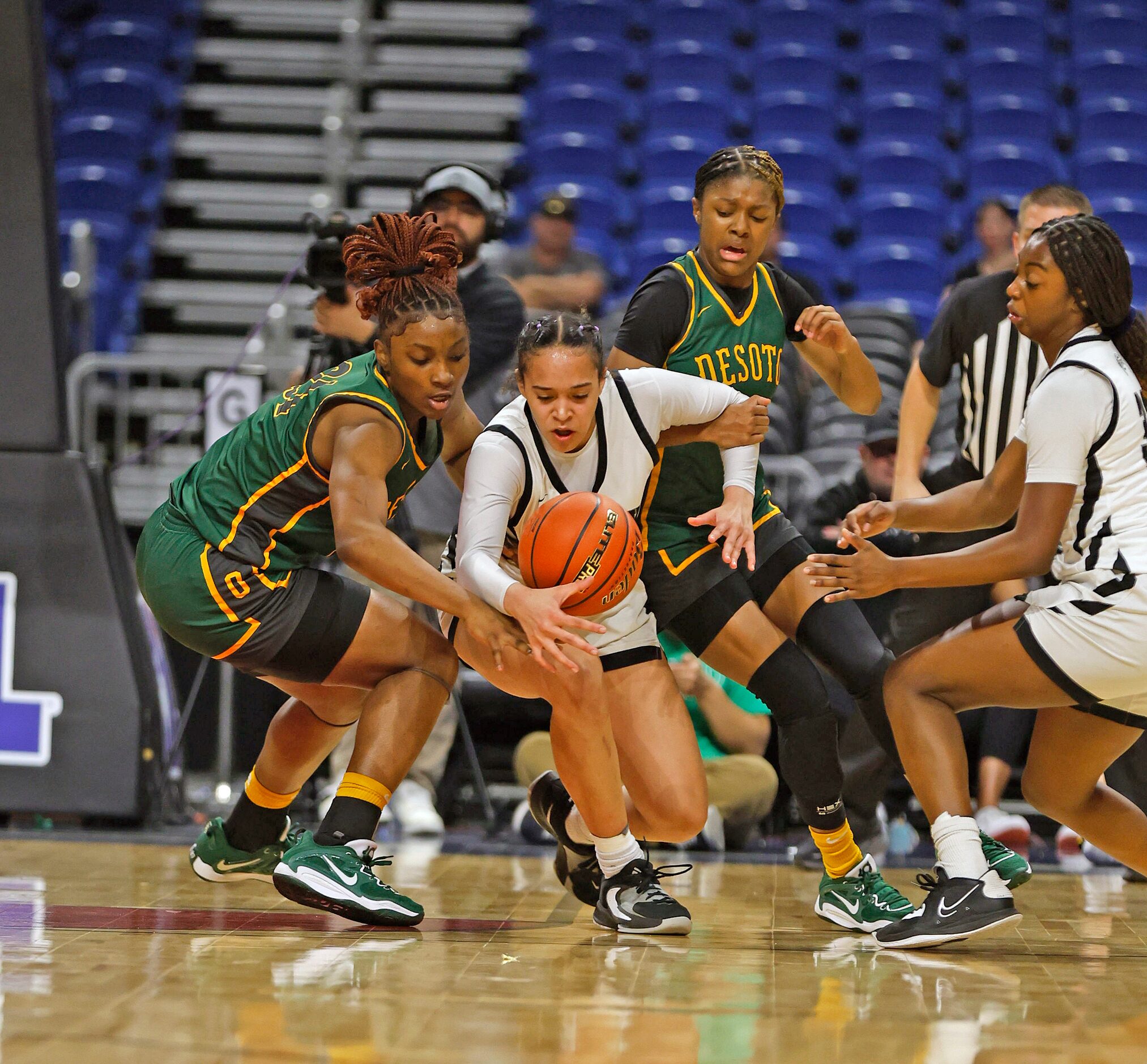 Desoto Amayah Garcia (25) tries to make a steal on Clark Cougars’ Kamryn Griffin (24) in...