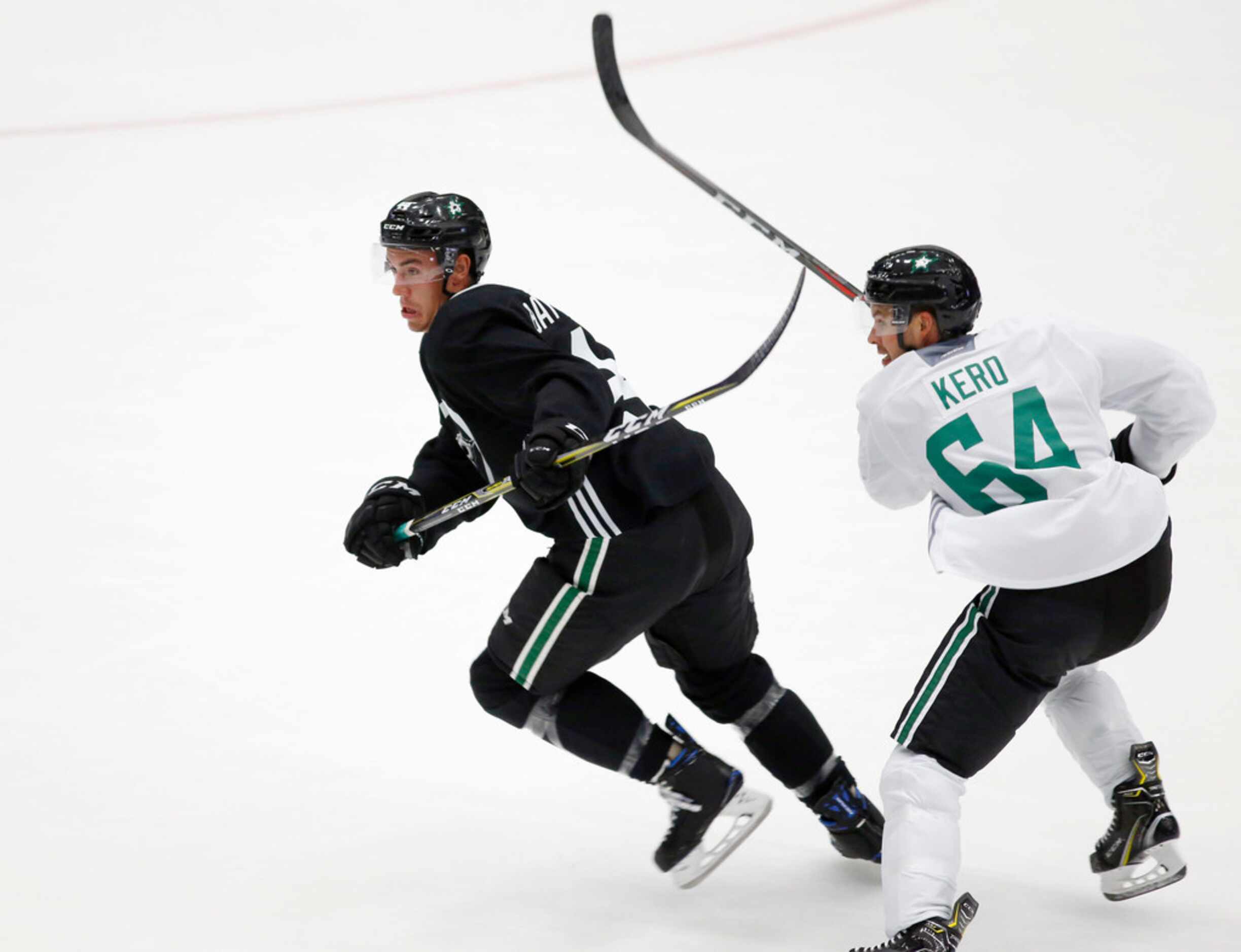 Dallas Stars Gavin Bayreuther (44) and Dallas Stars Tanner Kero (64) go after the puck...