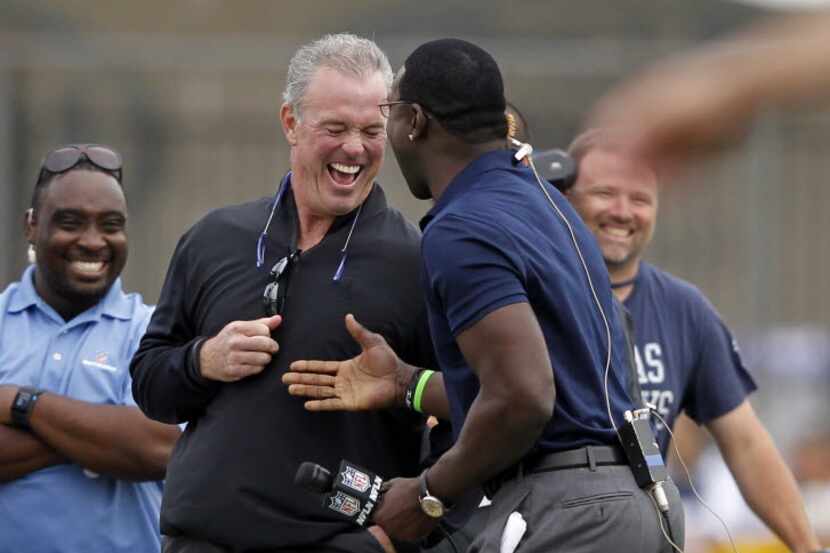 Dallas Cowboys vice president Stephen Jones shares a laugh with former Dallas Cowboys player...