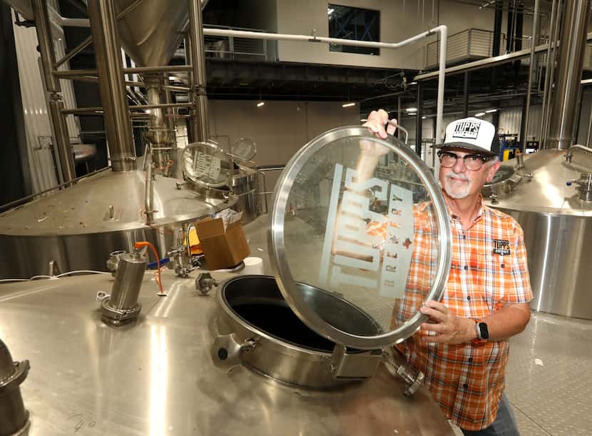 Keith Lewis poses for a photograph at the newest TUPPS Brewery under construction in...