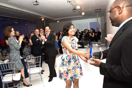 Raviola Wenno, a senior at North Dallas High School, accepts the award for Debater of the...
