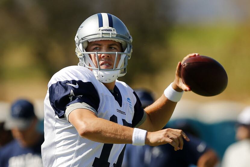 Dallas Cowboys quarterback Kellen Moore (17) looks for a receiver during afternoon practice...