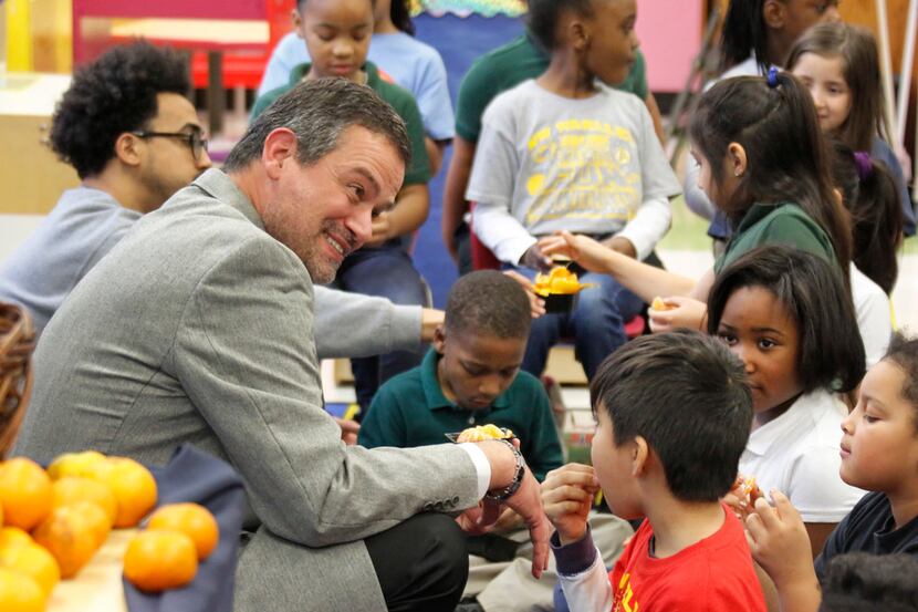 Michael Rosenberger, DISD director of food and child nutrition services visits with students...