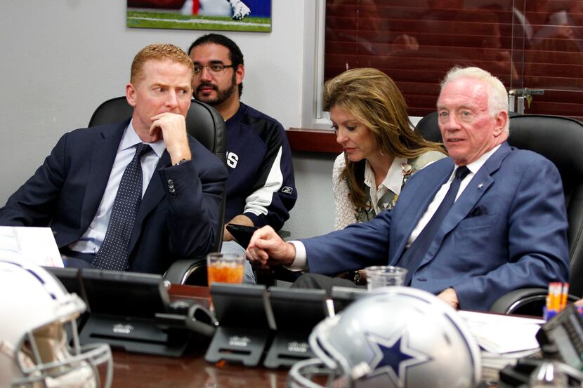 Cowboys head coach Jason Garrett (left) glances at owner and general manager Jerry Jones...