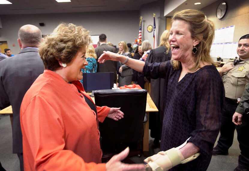 Travis County District Judge Julie Kocurek (right) was welcomed back to the bench by...