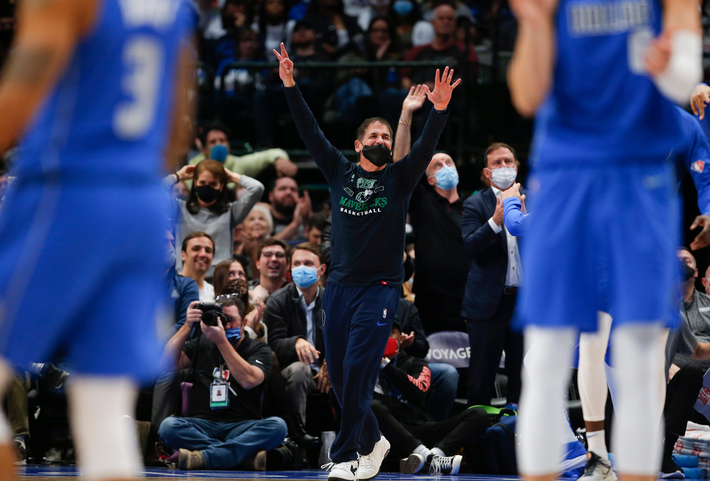 Dallas Mavericks owner Mark Cuban cheers on his team during the second half of an NBA...