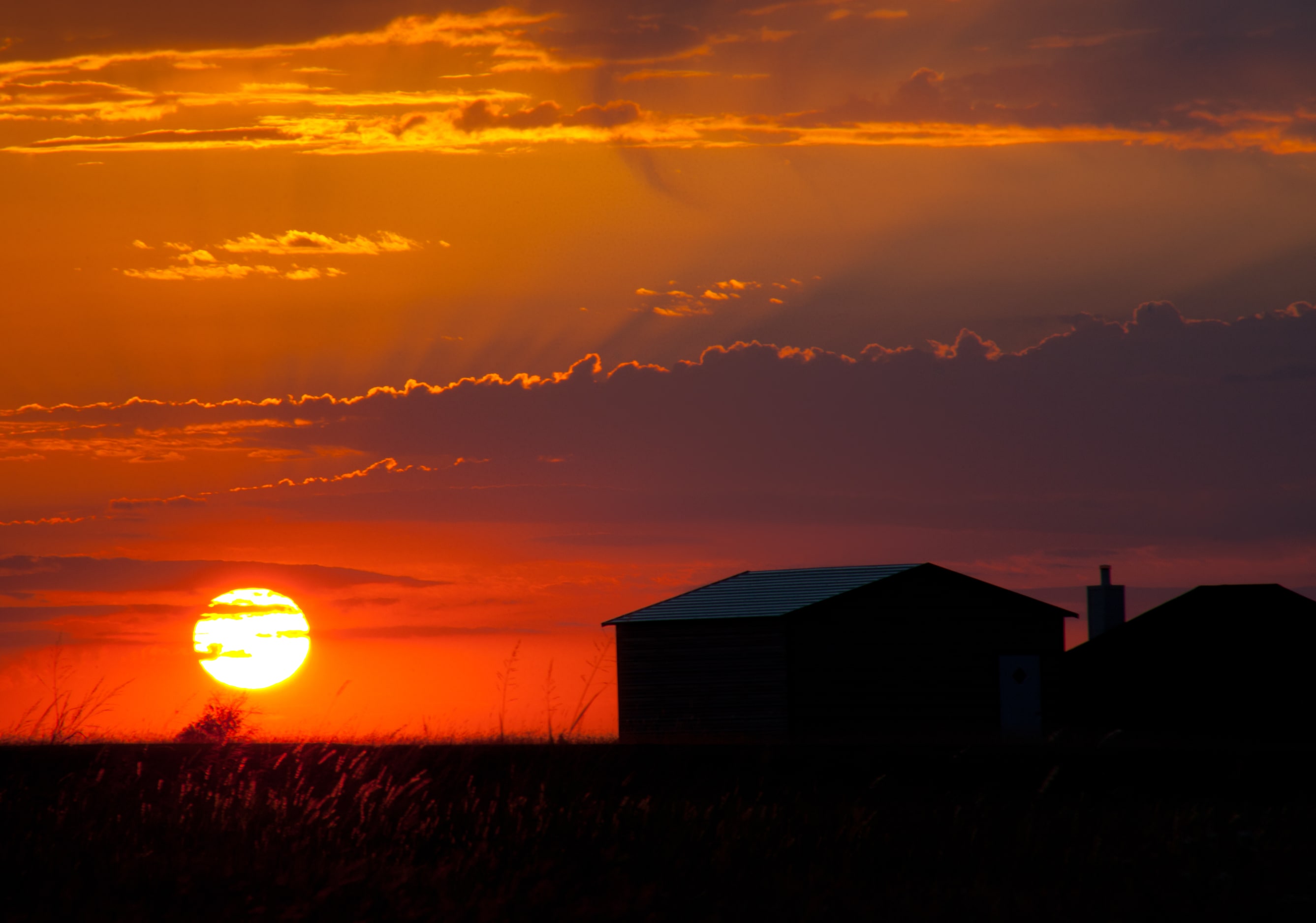 "Nightfall" by Mark Adler shows the sun setting near Crandall, TX. 