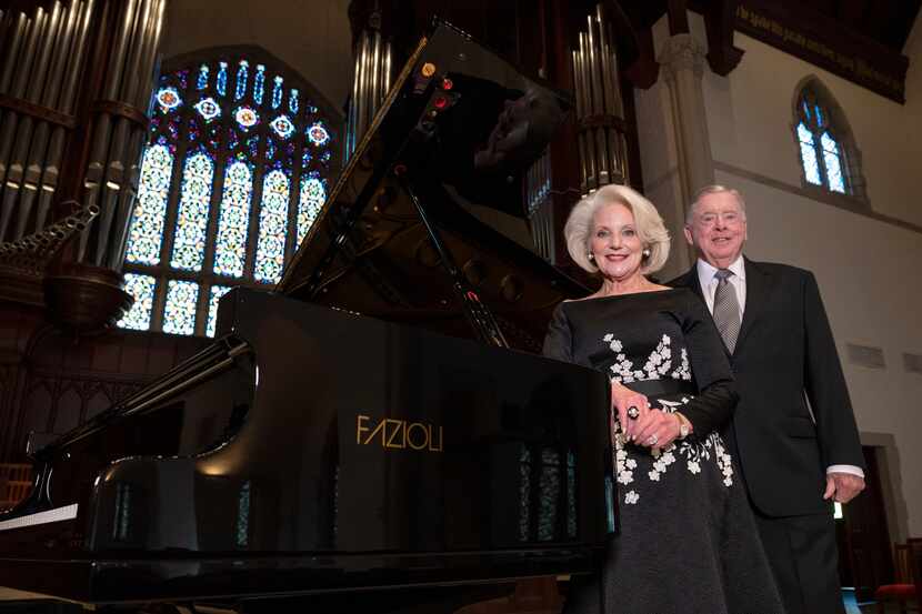 Dianne and Jack Adleta with the Fazioli grand piano they played an instrumental role in...