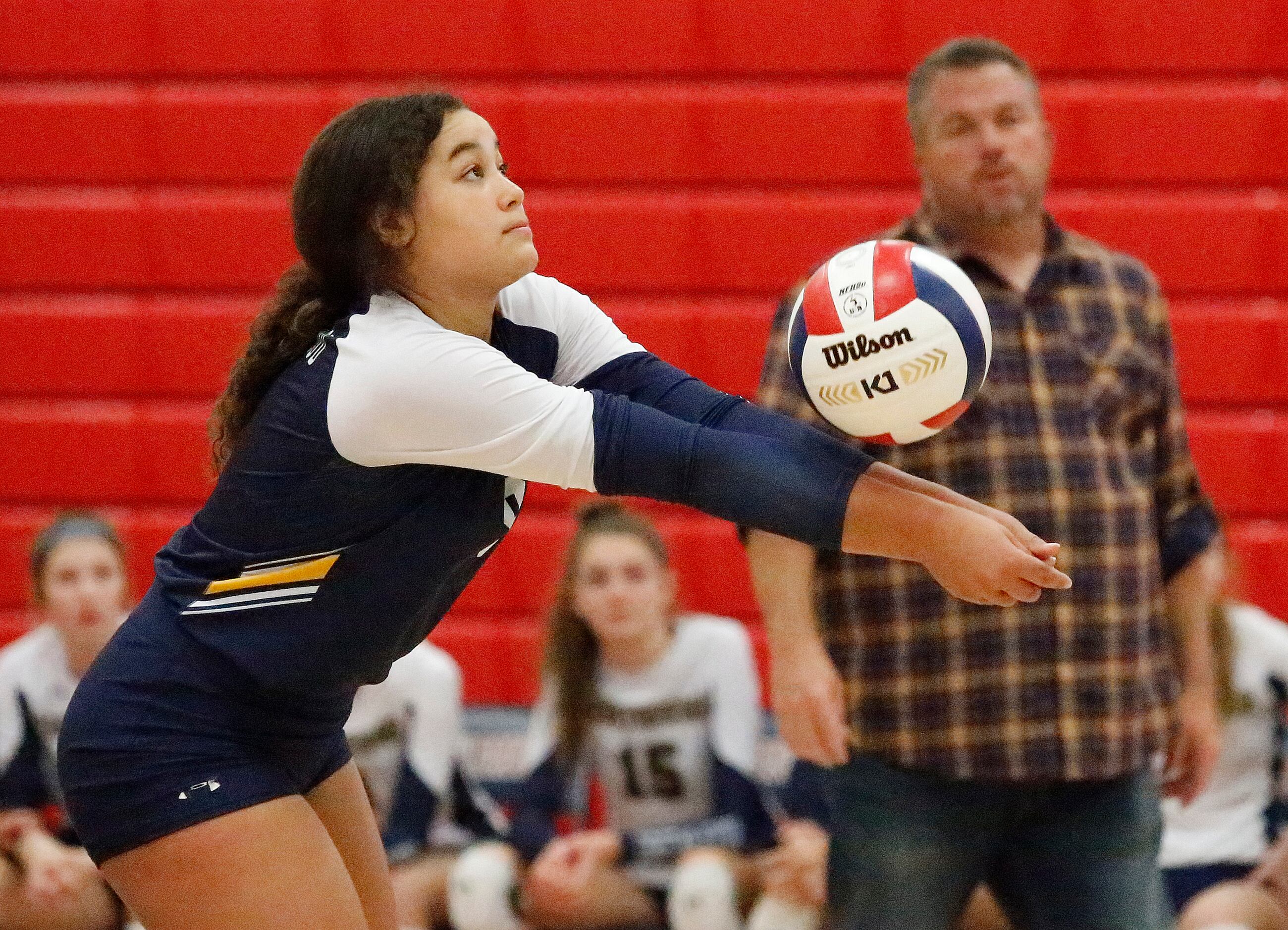 Prestonwood Christian Academy libero Gillian Pitts (8) receives a serve during game one as...