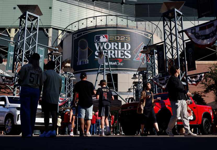 Arizona Diamondbacks fan wait to get into Chase Field for Game 3 of the World Series against...