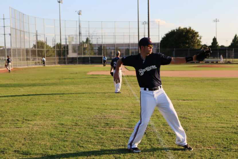 This file photo shows a man warming up in 2019 before a Plano men's baseball league at...