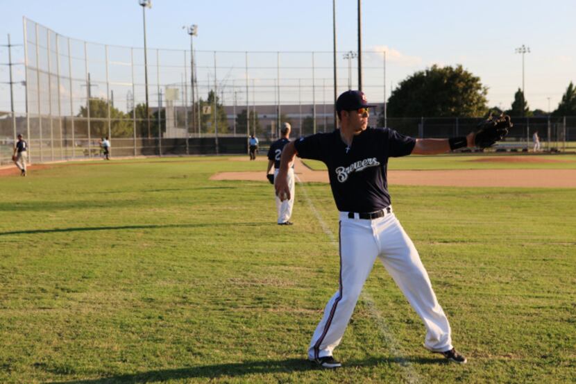 This file photo shows a man warming up in 2019 before a Plano men's baseball league at...