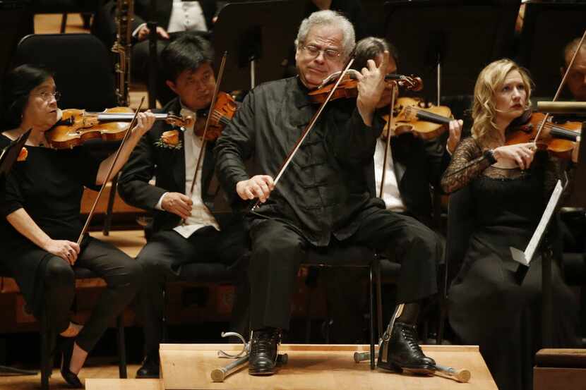 Violin soloist Itzhak Perlman performs with the Dallas Symphony Orchestra  at the Meyerson...