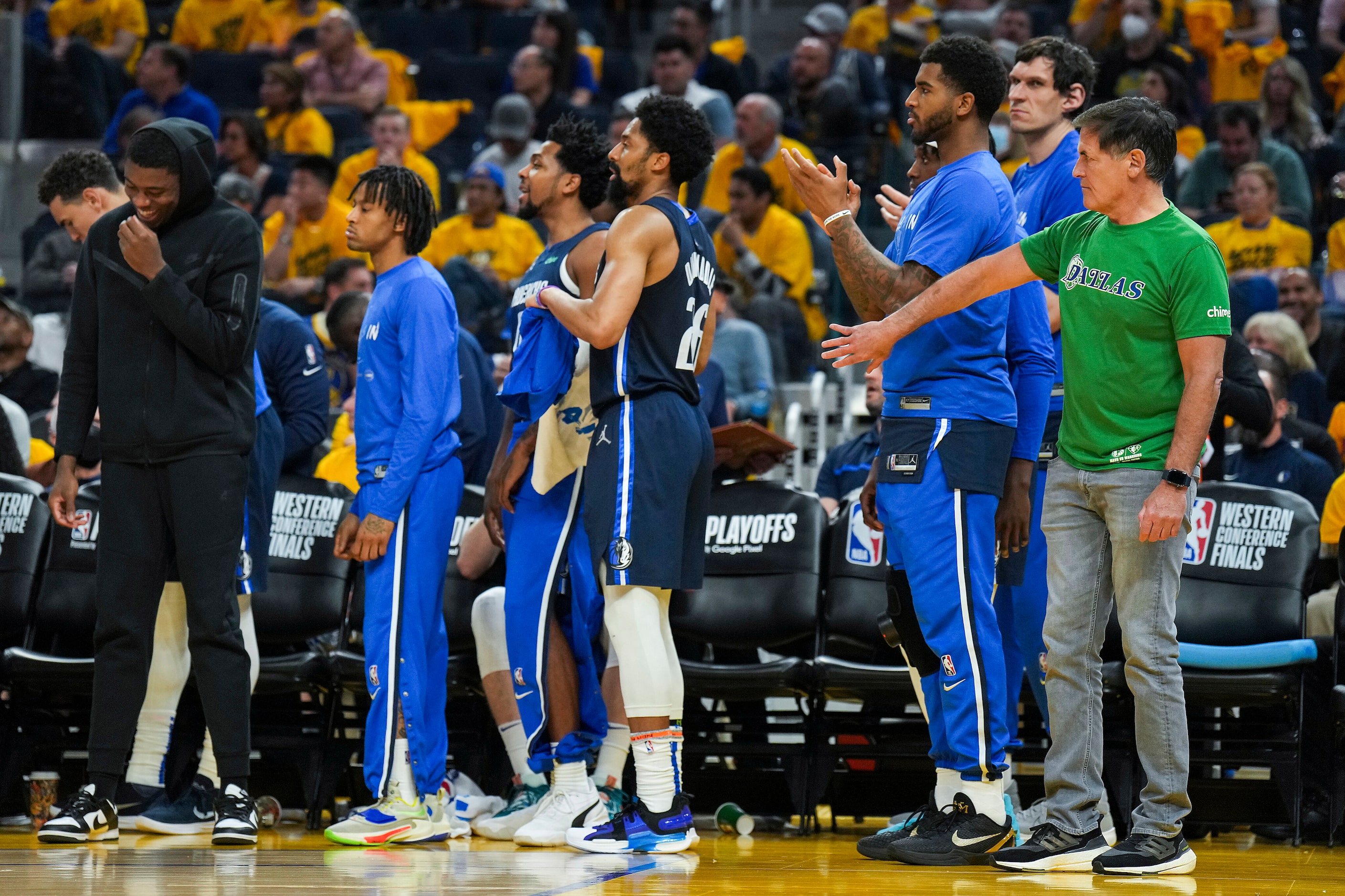 Dallas Mavericks owner Mark Cuban motions for the team’s players on the bench to step off...