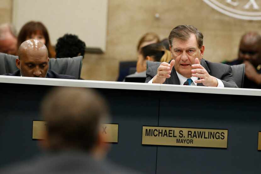 Mayor Mike Rawlings asks questions to Atmos Energy representatives about gas lines at Dallas...