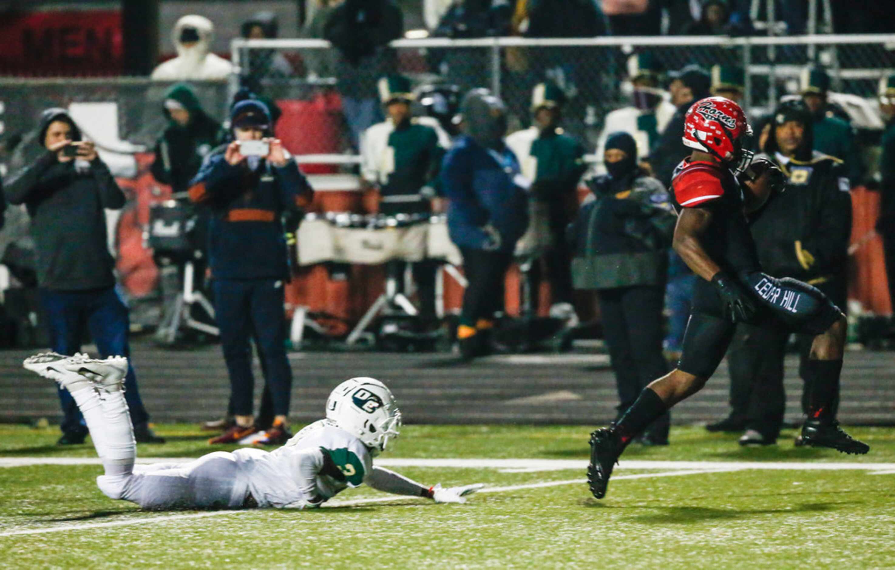 Cedar Hill running back Kevin Young (5) trots in a touchdown past DeSoto defensive back...