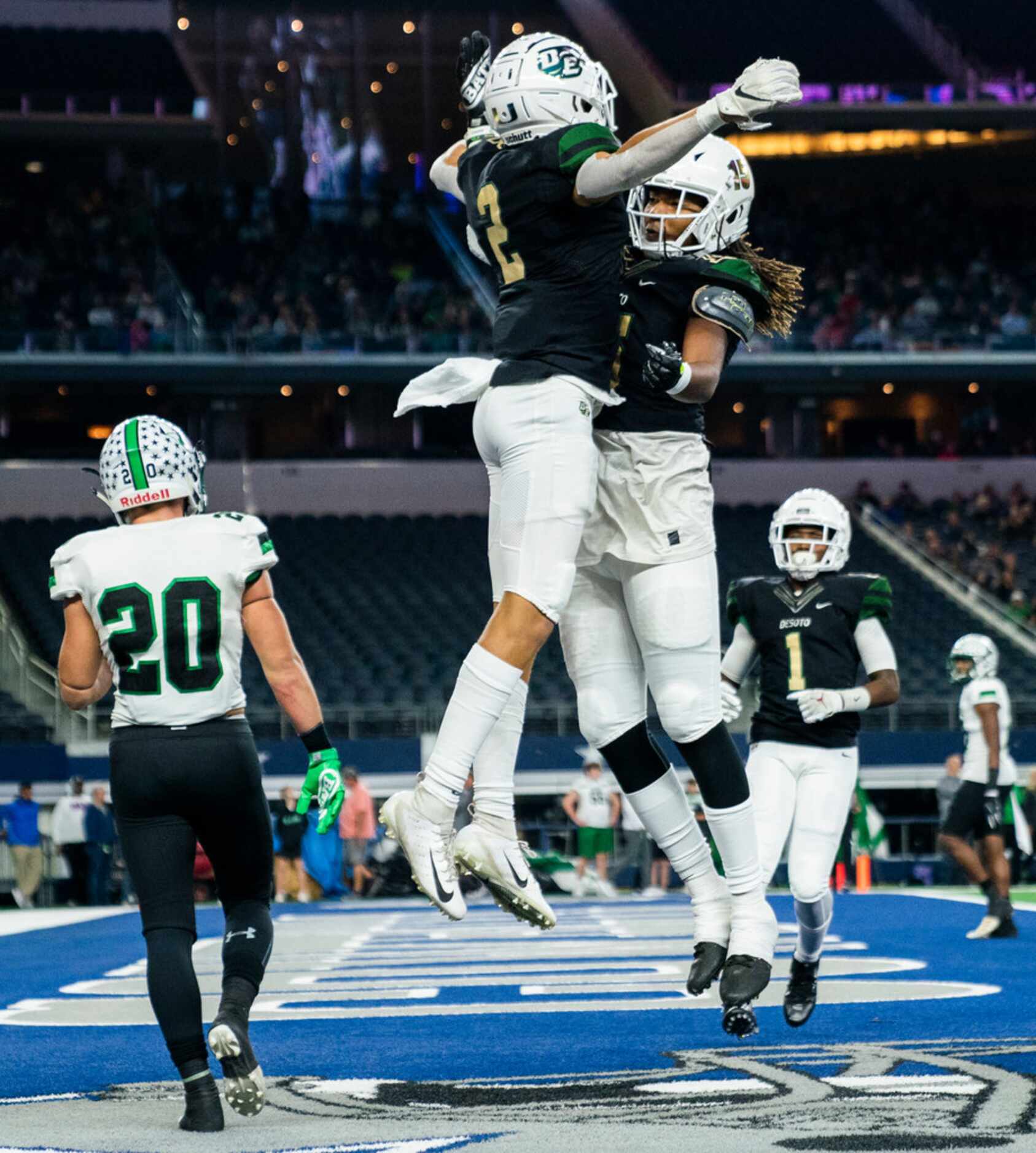 DeSoto wide receiver Lawrence Arnold (2) celebrates a touchdown with tight end Javon Charles...