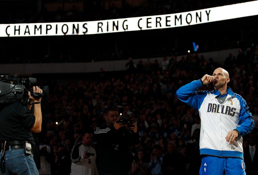 Dallas Mavericks point guard Jason Kidd (2) kisses his NBA championship ring during the ring...