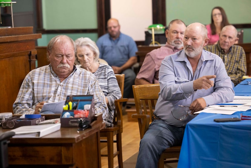 Commissioner Lloyd Lane (right) questions David Yoskowitz, Texas Parks & Wildlife Department...