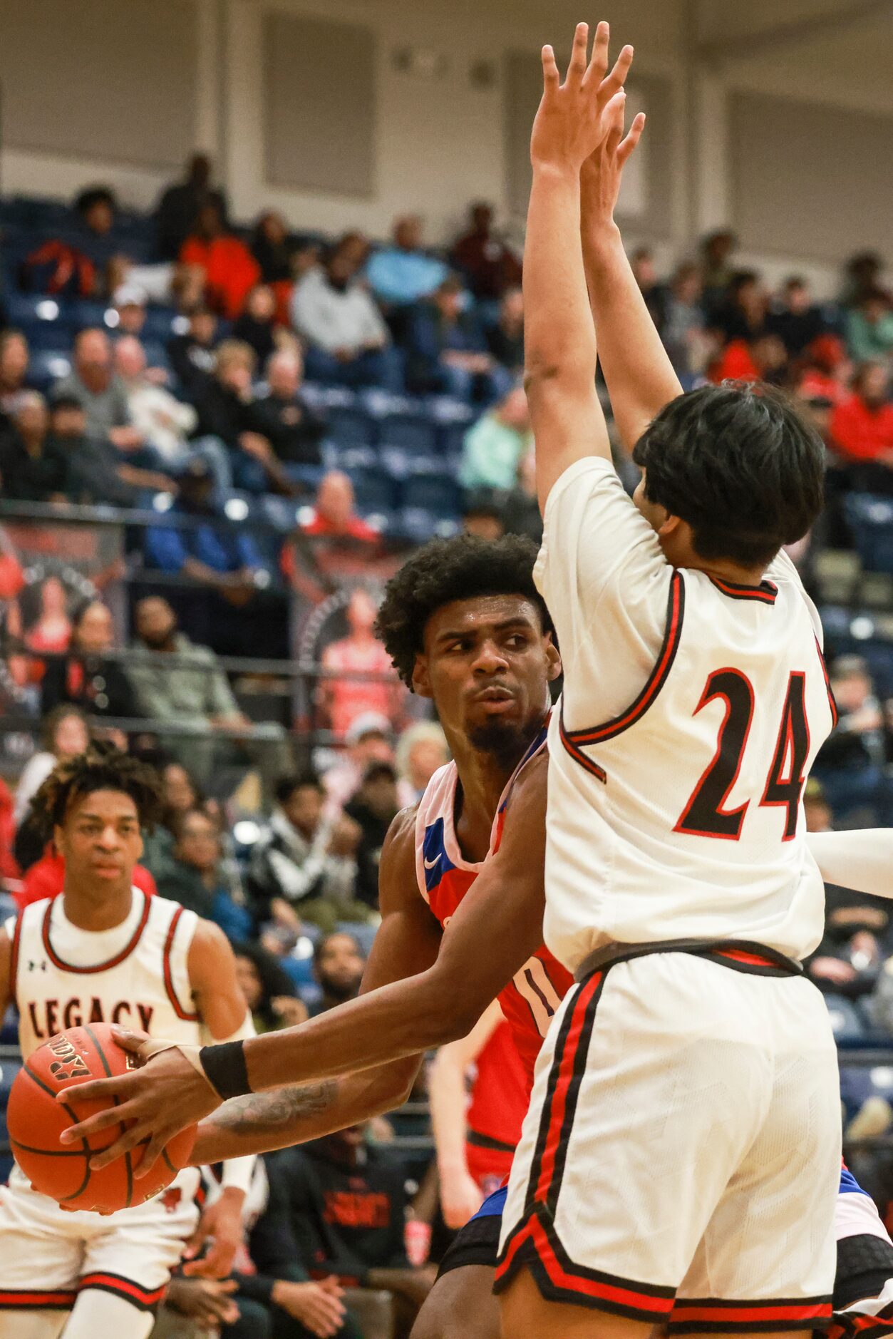 Duncanville High School’s K.J. Lewis (0) is defended by Mansfield Legacy High School’s Allen...